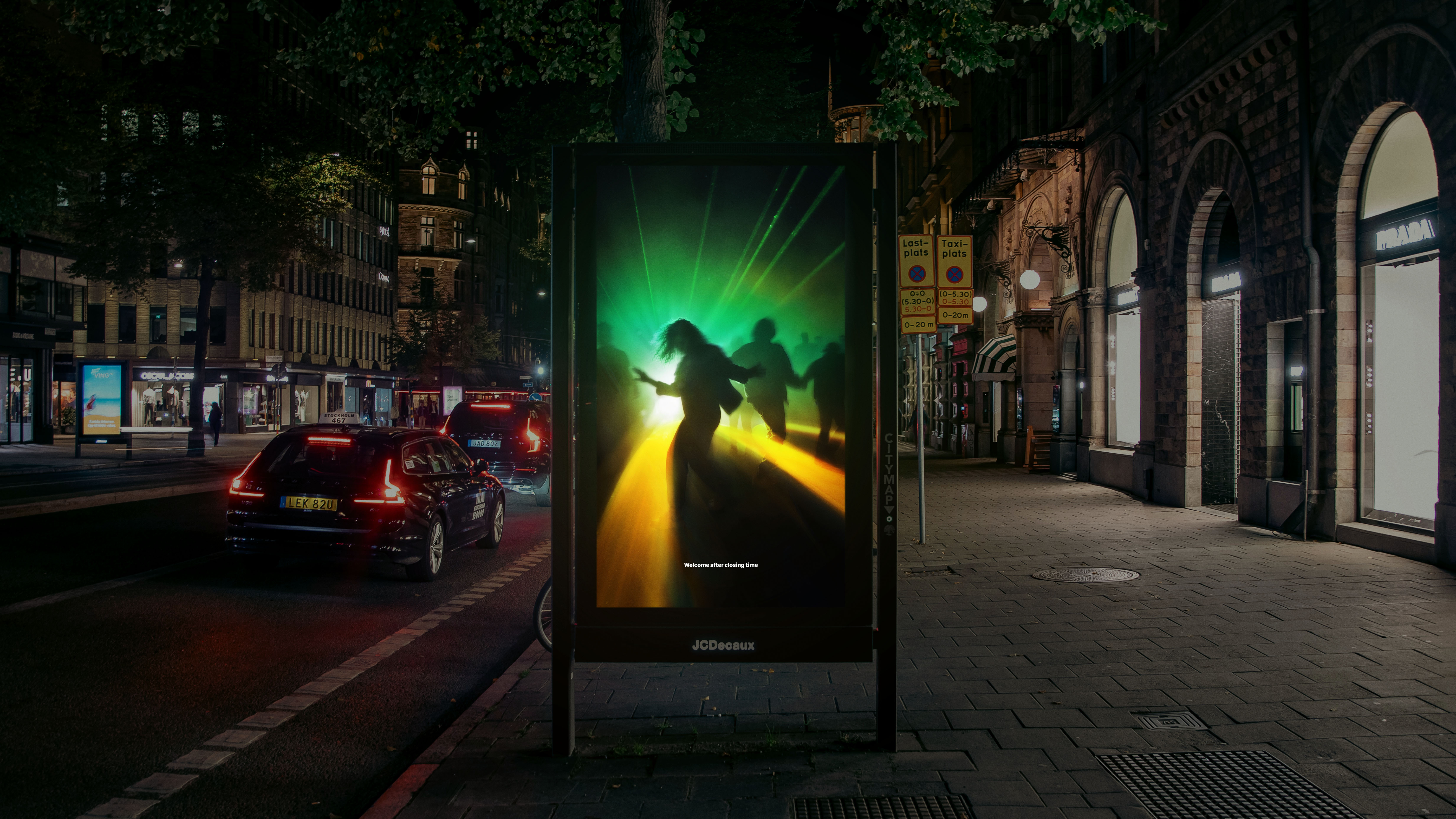 An image of a poster on a bus shelter showing a McDonald's advert featuring an optical illusion in which the Mcdonald's logo looks like lights shining on the floor in a nightclub