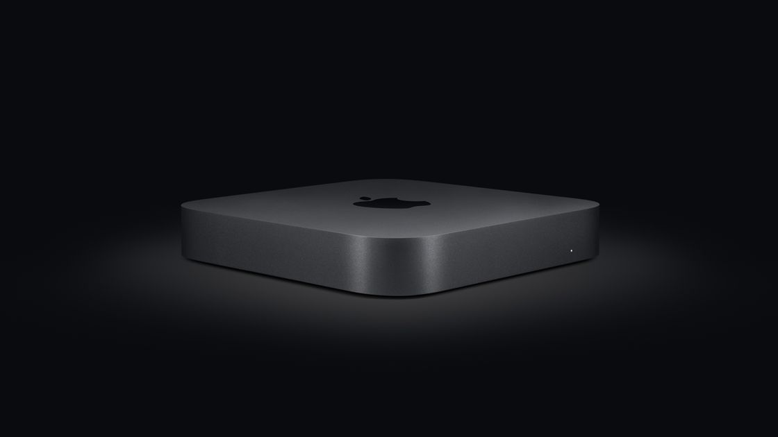 The Mac mini 2020 sat in a dark room, illuminated by a single spotlight