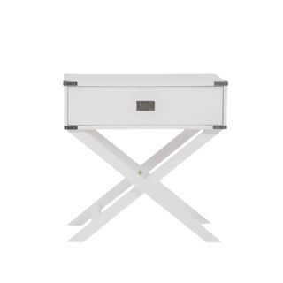 A white nightstand with crossed legs