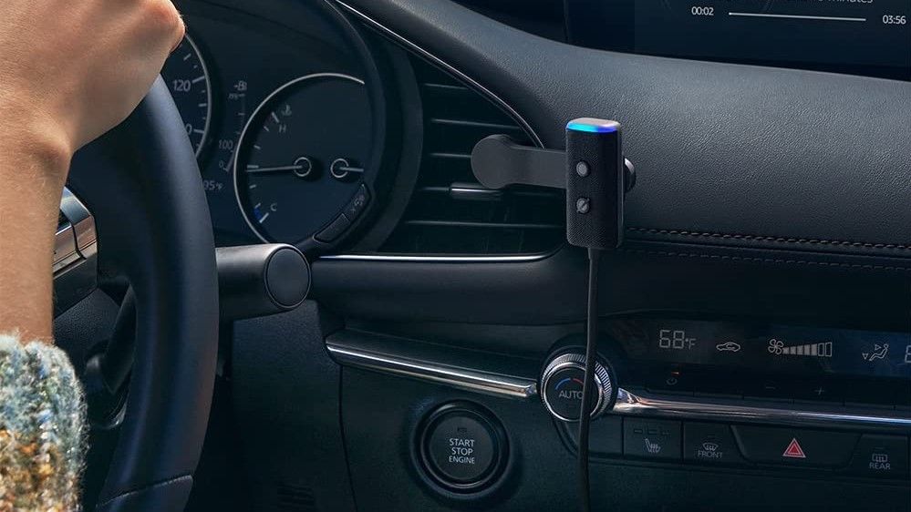 amazon echo auto mounted to left of steering wheel