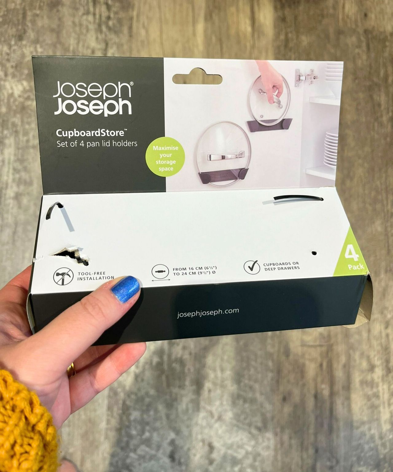 The Joseph Joseph pan lid holders came in a set of four in a small package as pictured in my hand