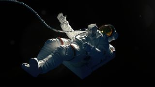 Astronaut on a black background hovering in an outer space.