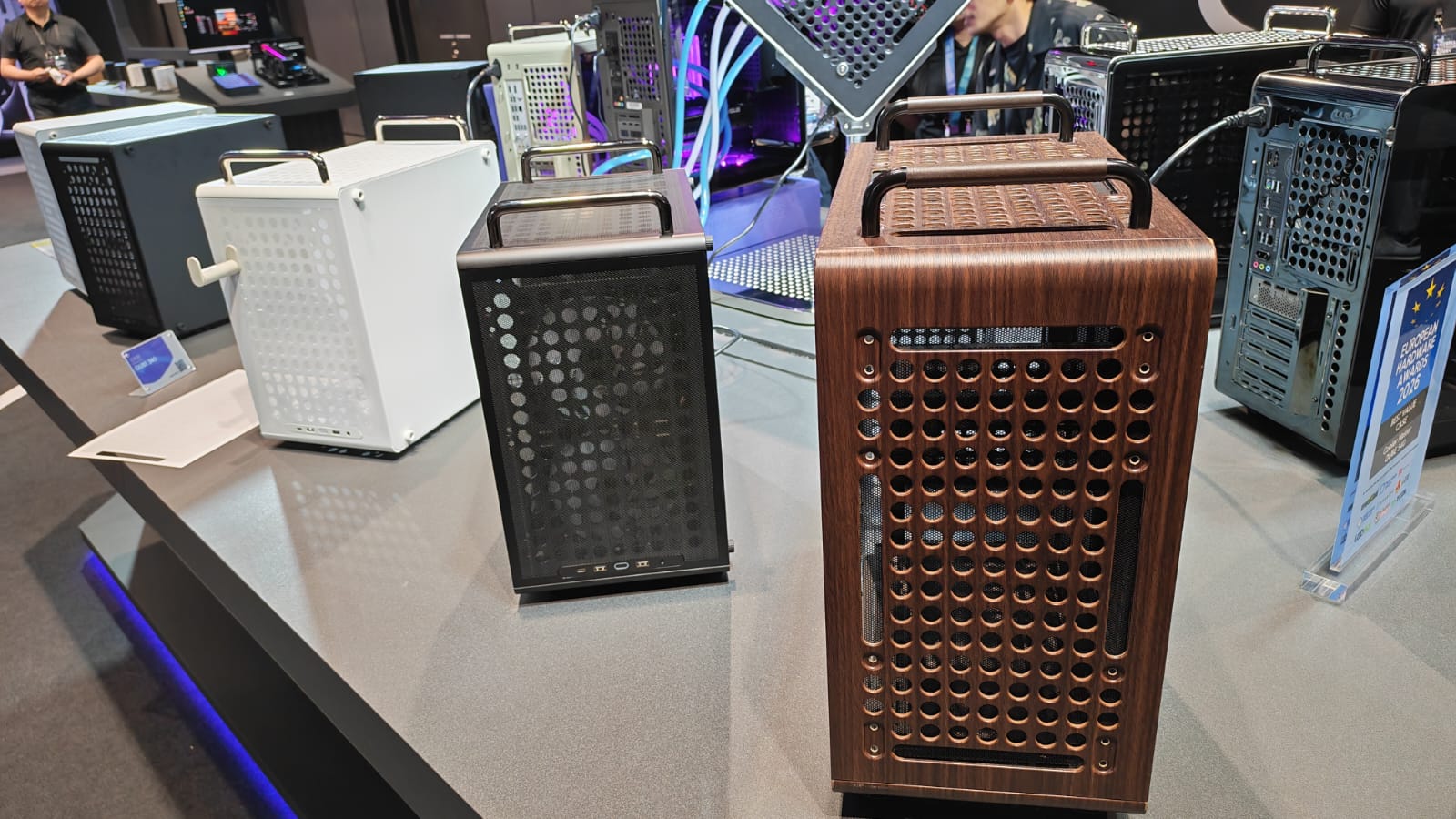 Three Cooler Master Q300L V3 cases with different finishes at Computex