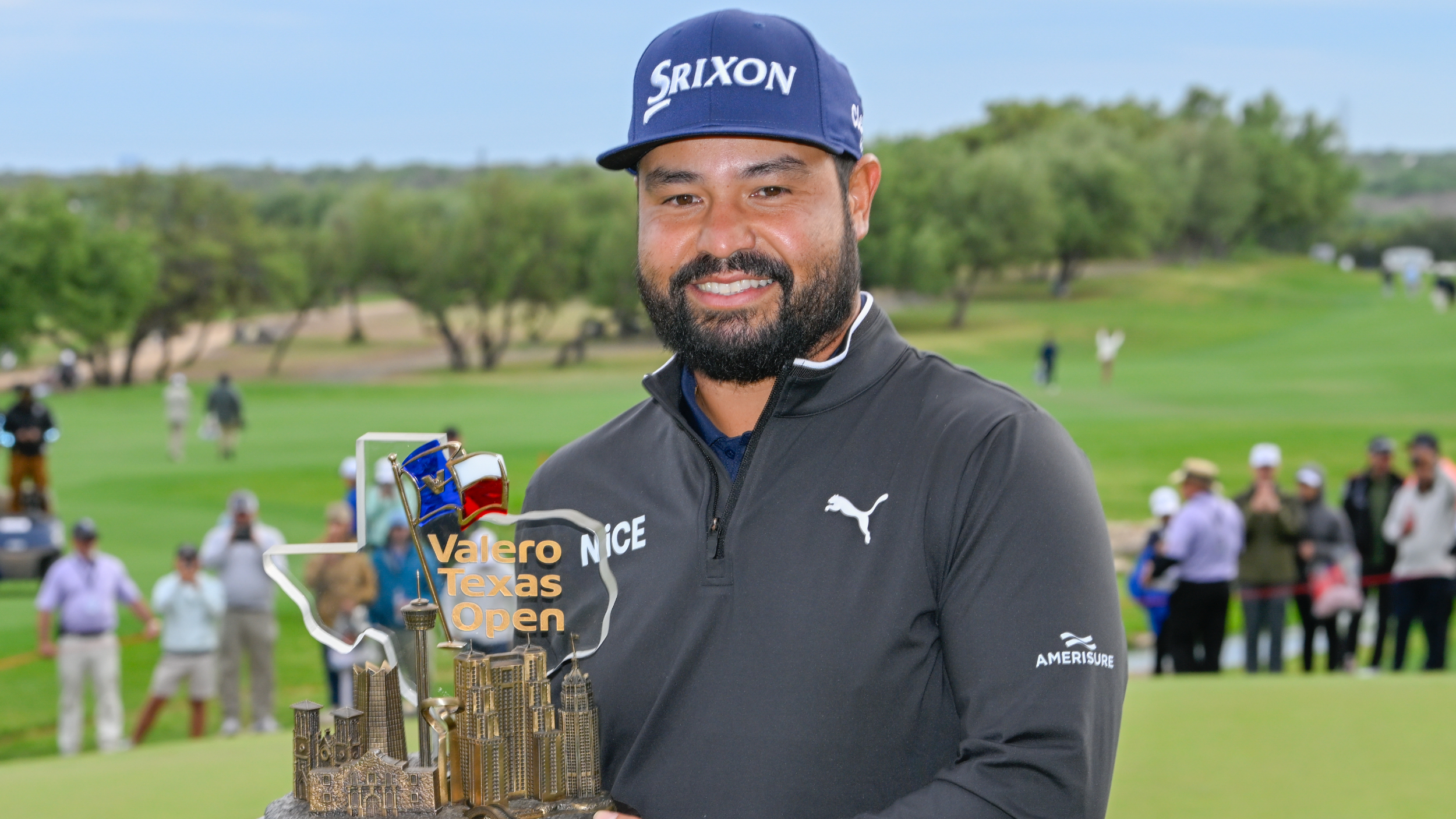 JJ Spaun holds the Valero Texas Open trophy