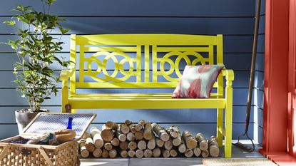 garden bench painted bright yellow
