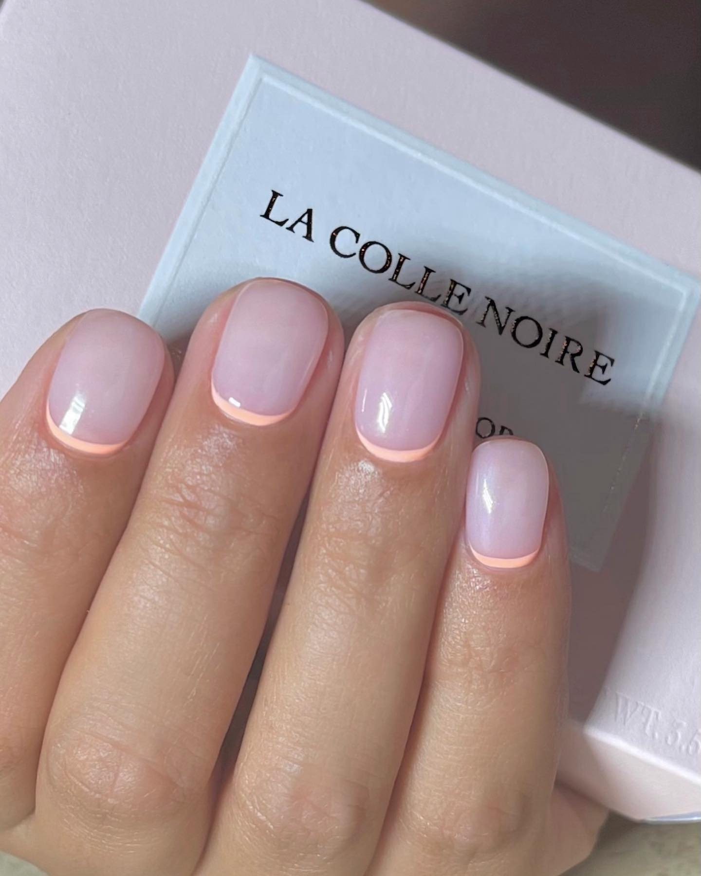 A pastel reverse French manicure design