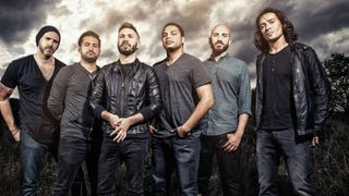 Periphery group shot against a darkened sky