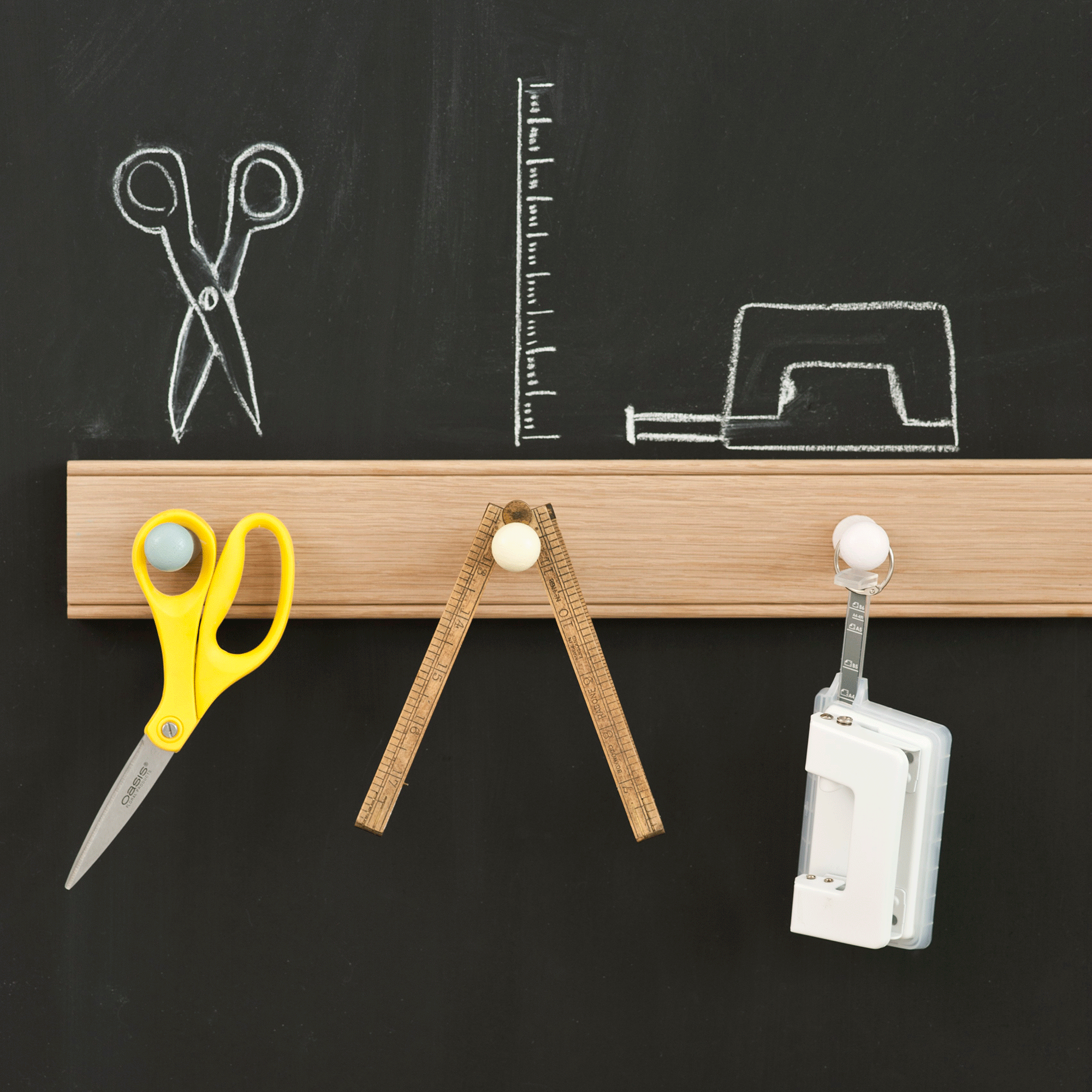 Blackboard with wooden railing and tools
