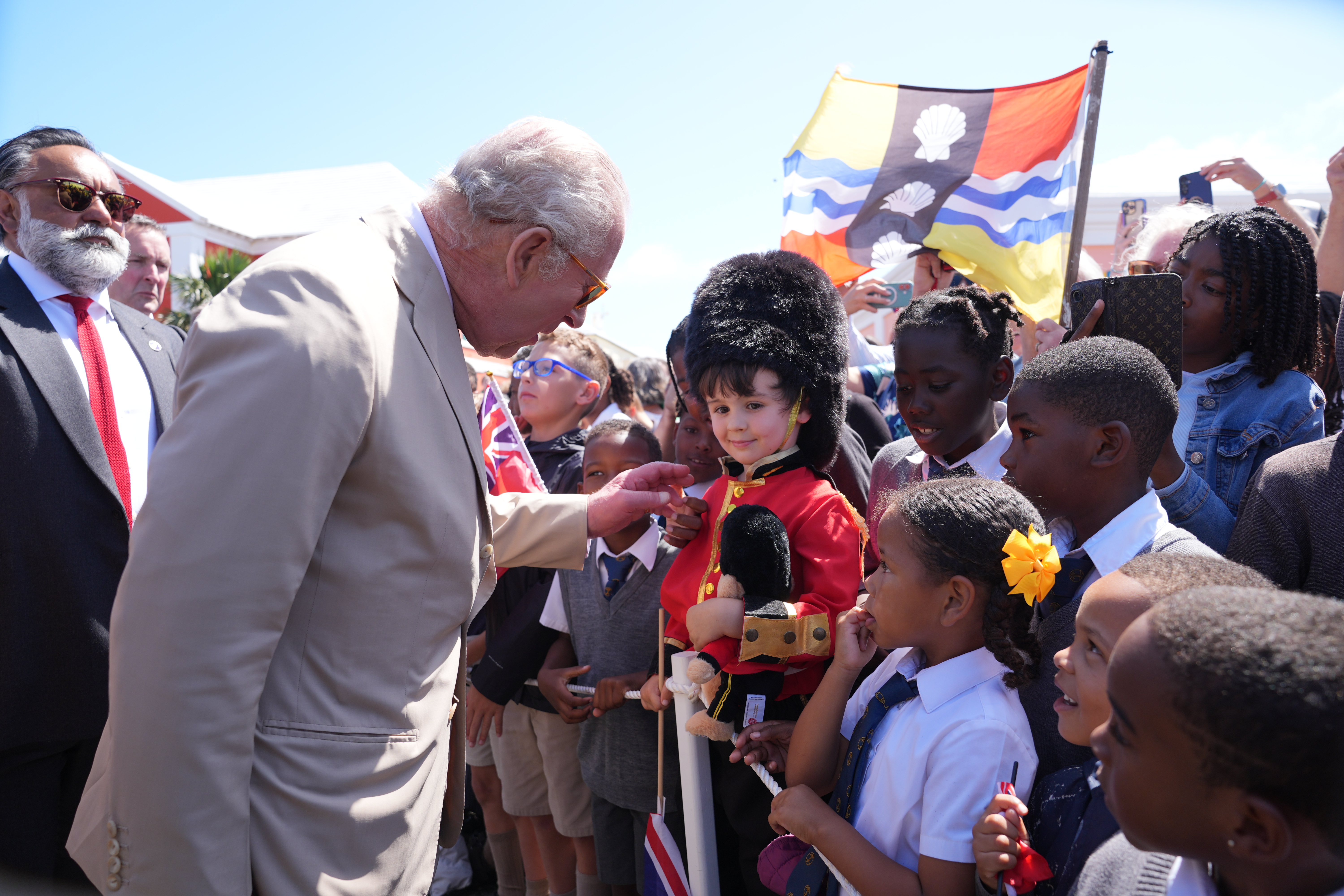King Charles III speaks to well-wishers during a ceremonial welcome at King's Square on May 1, 2026 in St. George's, Bermuda