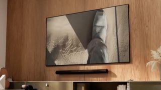 A still from a leaked video showing what purports to be the rumoured Sonos Arc Ultra soundbar beneath a wall-mounted TV.