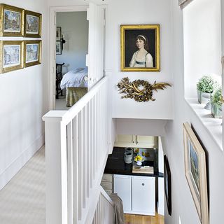 stairwell with white wall and frame on wall
