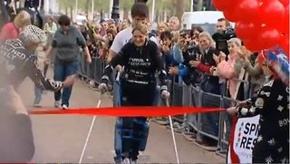 Claire Lomas, paralyzed from the waist down, finishes the London Marathon.