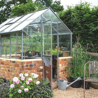 metal greenhouse with dwarf wall