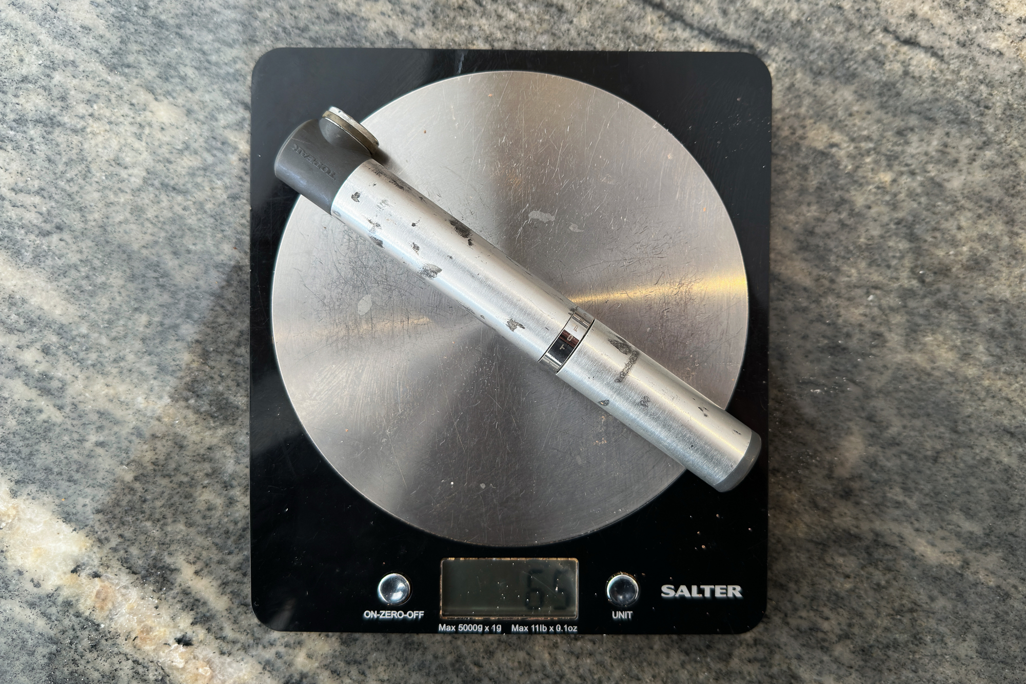 a mini pump on some digital scales which read 65g