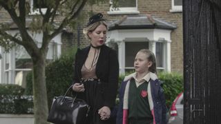 Katherine Ryan walks beside a child in The Duchess on Netflix