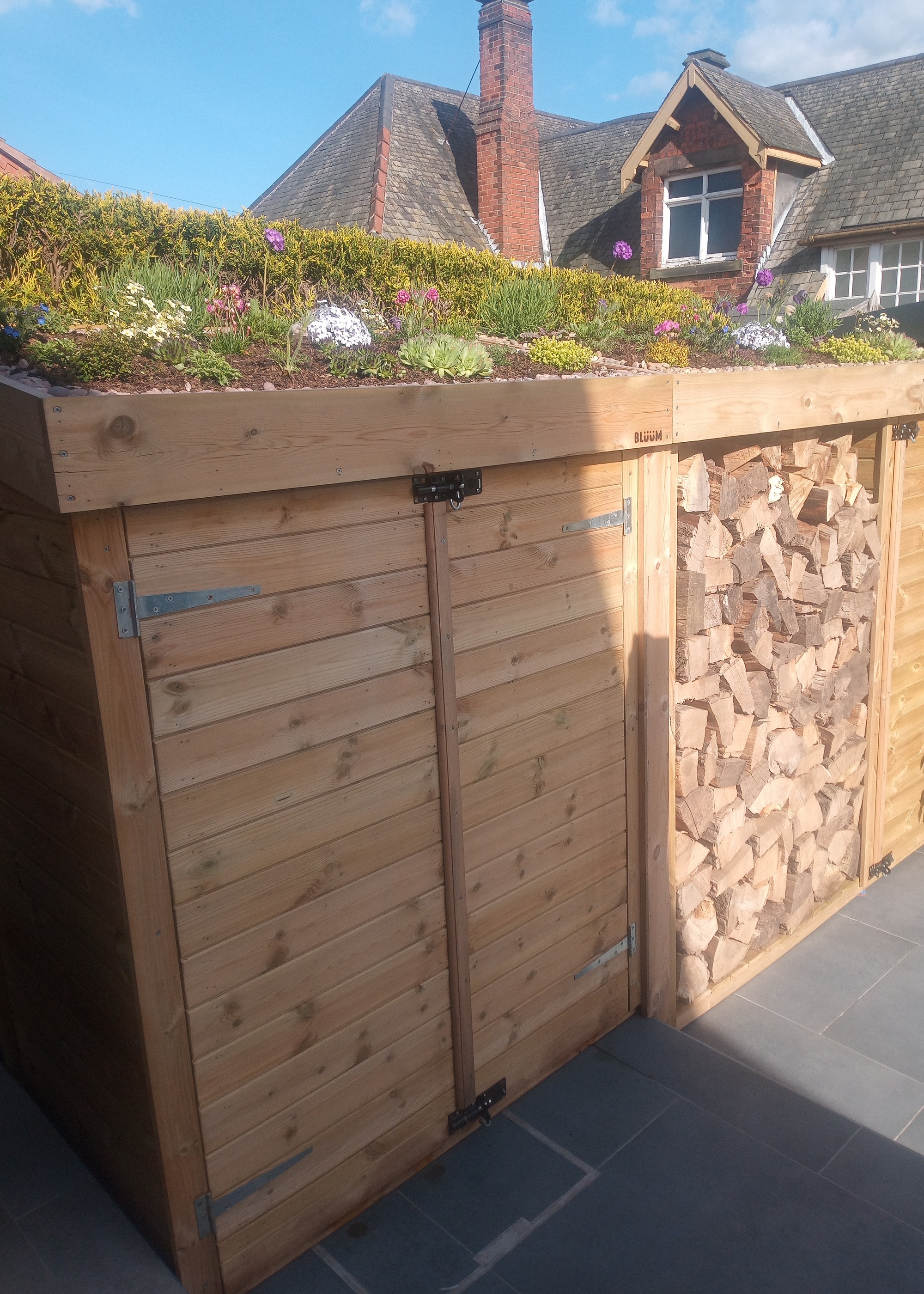 wooden garden storage with sedum 'green' roof