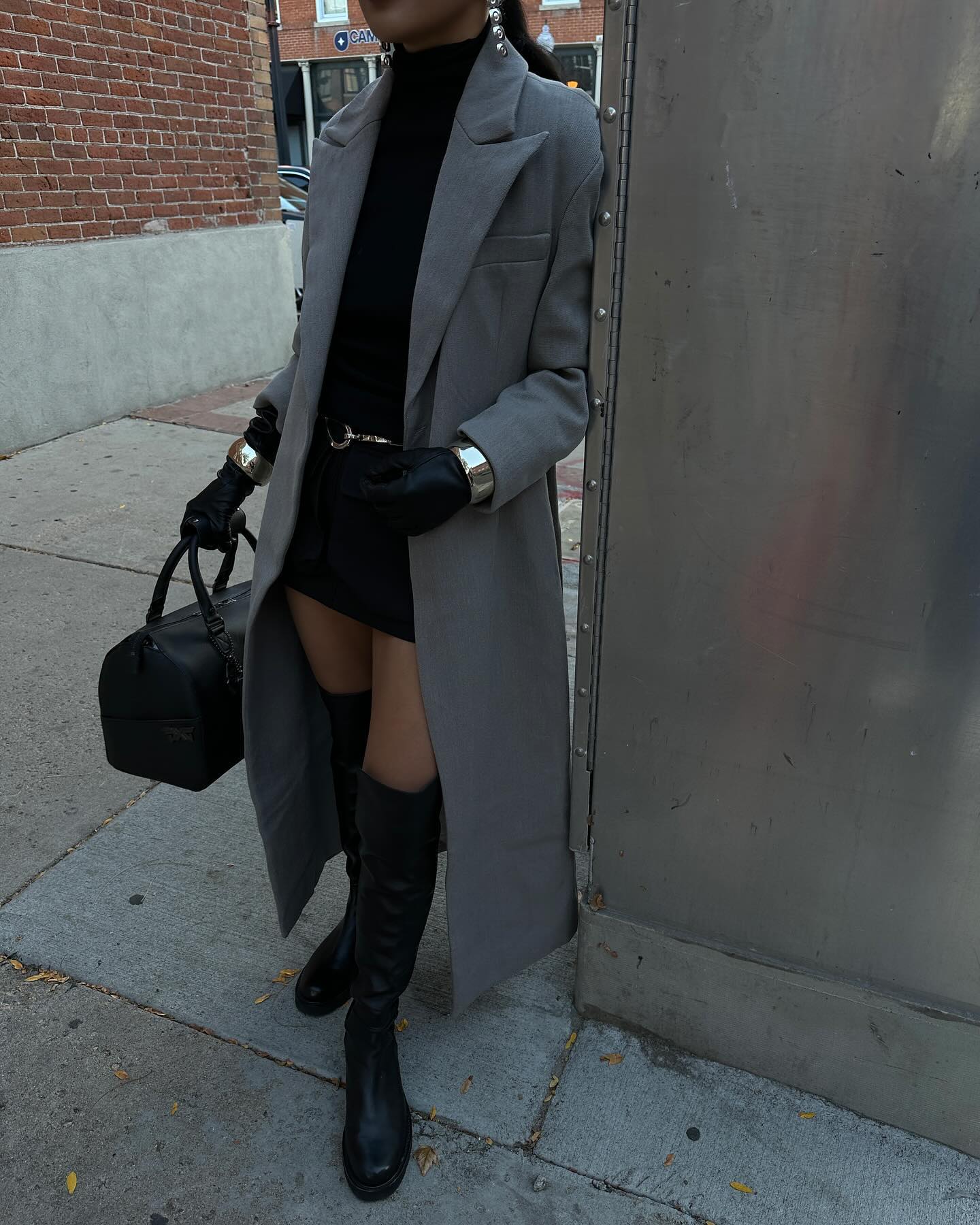 Stylish women wearing mini dresses and knee high boots
