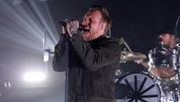 Sam Carter screaming on stage