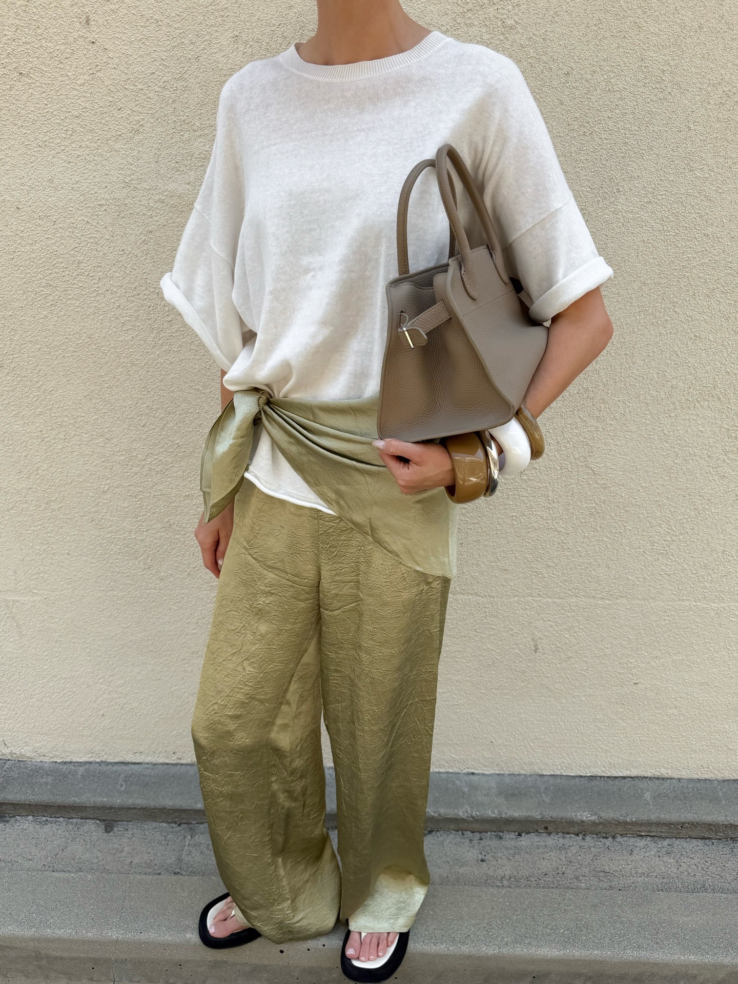 Elsa Hosk wears satin pants fall trend outfit.