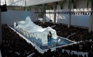 Models donned special transparent Chanel galoshes to wade through the watery catwalk and pace around the frozen set