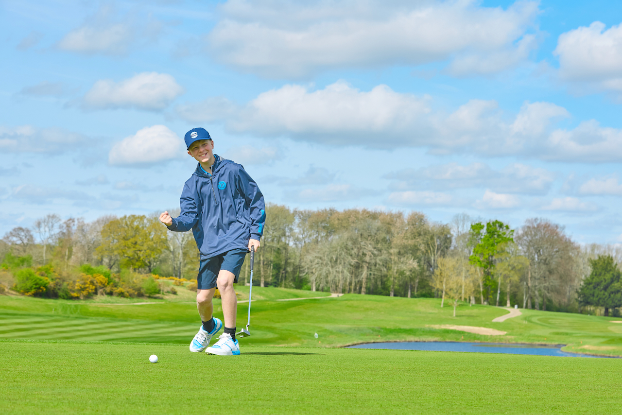A child enjoying himself on the course