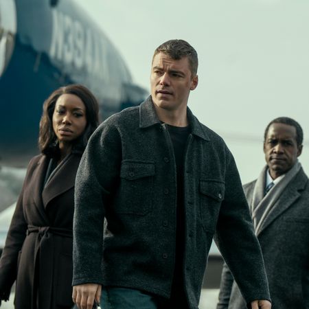 gabriel basso as peter sutherland, amanda warren as catherine weaver, and albert jones as aiden mosley exiting a plane on a jetway in a still from the night agent season 3
