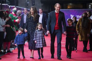 Prince William, Duke of Cambridge and Catherine, Duchess of Cambridge with their children, Prince Louis, Princess Charlotte and Prince George, attend a special pantomime performance at London's Palladium Theatre