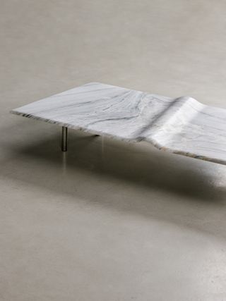 Wentz table with wave-like ripple in centre, from the Mar collection