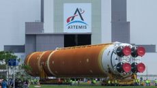 The SLS stage core for the Artemis II rocket is loaded into NASA's Vehicle Assembly Building on July 14, 2024.