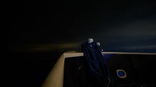The night sky off the bow of the SpaceX GO Navigator recovery ship is seen in this one second exposure photograph as NASA and SpaceX support teams prepare for the landing of the SpaceX Crew Dragon Resilience spacecraft with NASA astronauts Mike Hopkins, Shannon Walker, and Victor Glover, and Japan Aerospace Exploration Agency (JAXA) astronaut Soichi Noguchi aboard in the Gulf of Mexico off the coast of Panama City, Florida, Saturday, May 1, 2021.