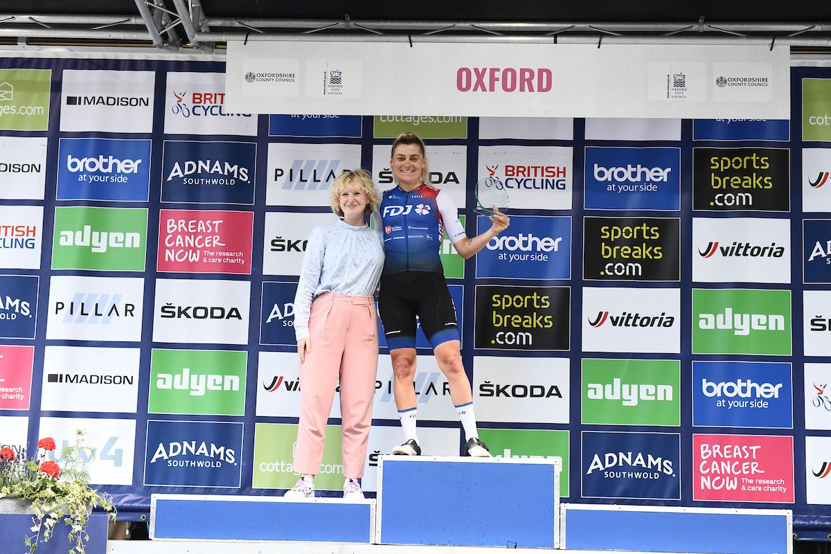 Picture by Simon Wilkinson/SWpix.com - 11/06/2022 - Cycling - The Womenâ€™s Tour 2022 - Stage Six - Chipping Norton to Oxford, England - Clara Copponi of Team FDJ Nouvelle Aquitaine Futuroscope on the podium