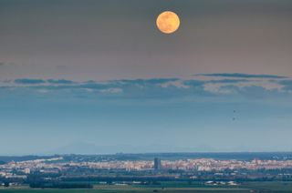 Photographer Sérgio Conceição shows the April 7 "Super Pink Moon," as captured from Elvas in Portugal.