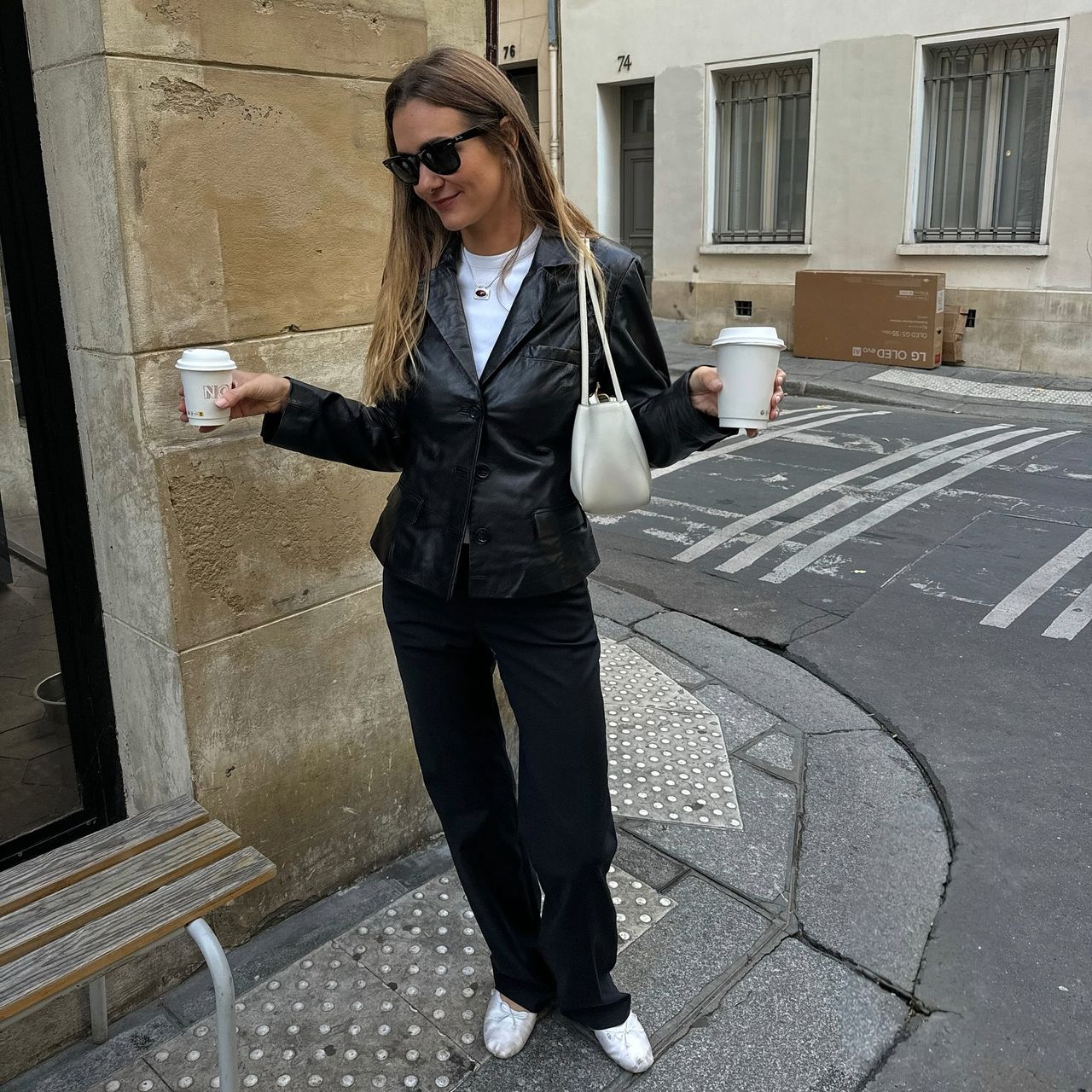Anne Laure Mais in a leather blazer and trousers