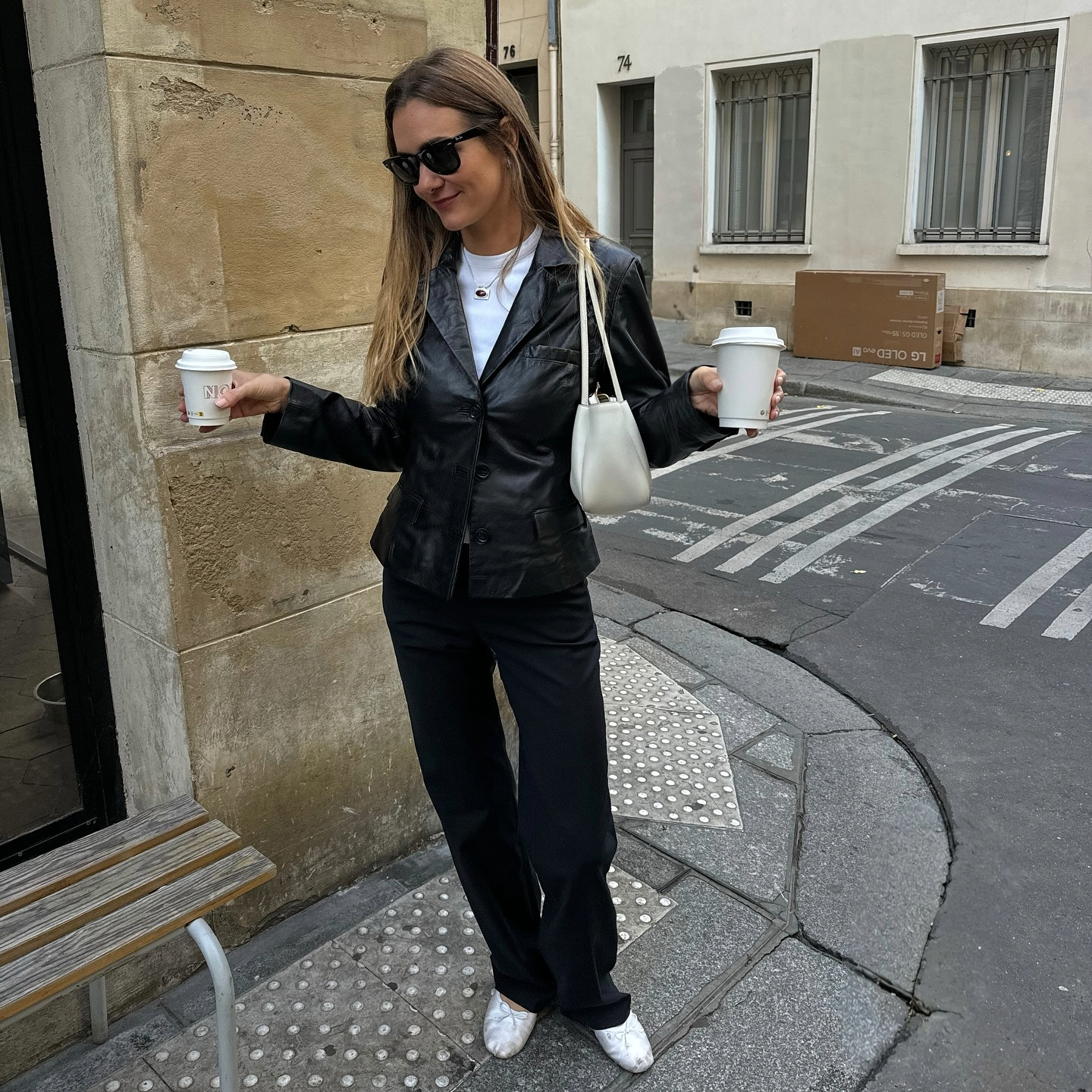 Anne Laure Mais in a leather blazer and trousers