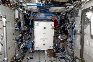 Astronaut Paolo Nespoli writes, "Robonaut in its crate gets moved from PMM to the Lab. We’ll unpack it later, unless it takes over the ISS earlier!"