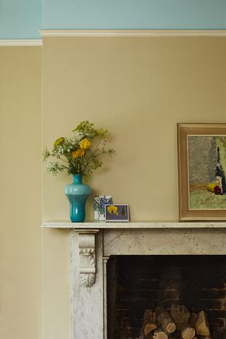 Yellow and blue living room with fireplace