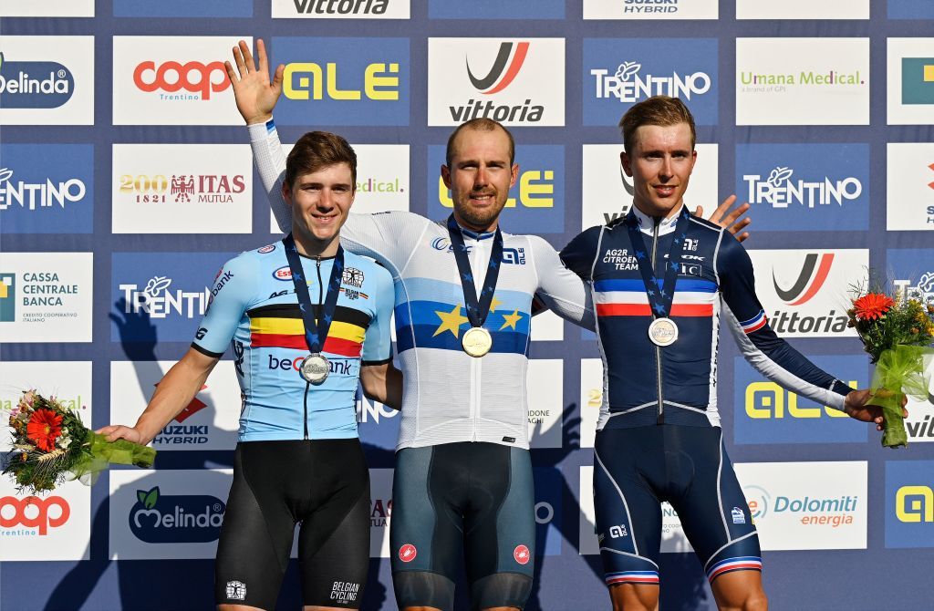 Italian Sonny Colbrelli C flanked by Belgian Remco Evenenpoel L and French Benoit Cosnefroy R celebrates on the podium after winning the UEC European men Elite road cycling championships in Trento on September 12 2021 Colbrelli won the race ahead of Belgian Remco Evenenpoel L placed second and France Benoit Cosnefroy R placed third Photo by Alberto PIZZOLI AFP Photo by ALBERTO PIZZOLIAFP via Getty Images