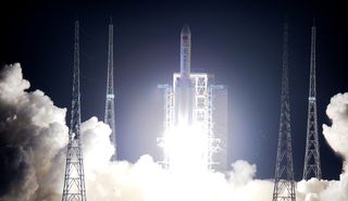 China's first heavy-lift Long March 5 rocket launches into space from the country's Wenchang launch center on Hainan Island at 8:43 p.m. Beijing Time on Nov. 3, 2016.