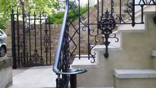 stone steps with a decorative handrail