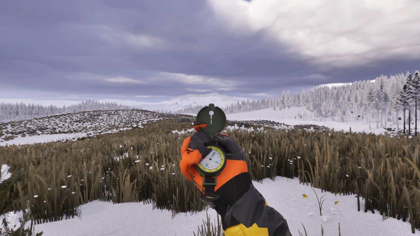 A gloved hand holding a compass in a snowy field