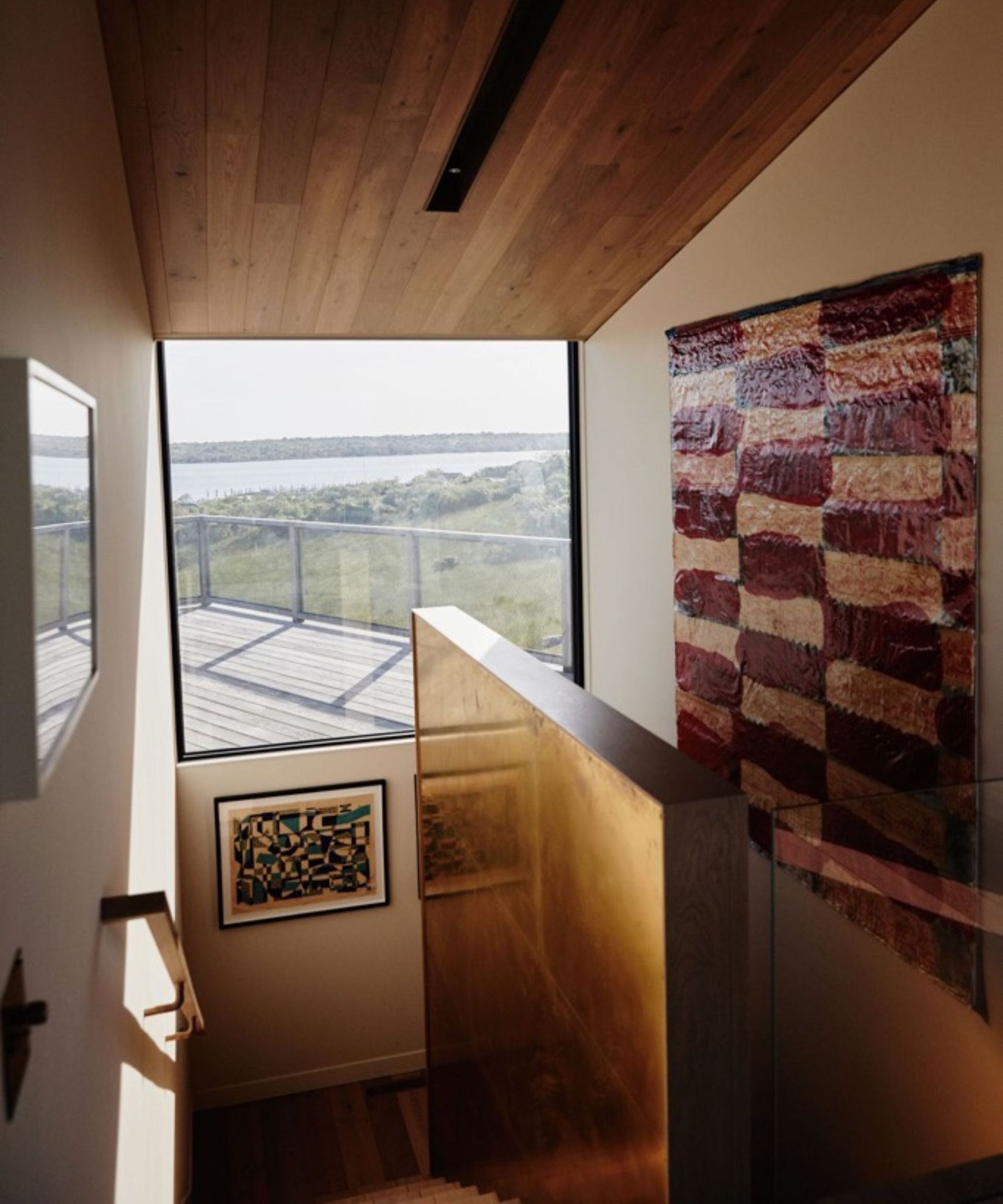 chused and co oversized checkerboard artwork in staircase