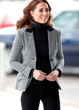 Kate Middleton wearing a grey blazer.