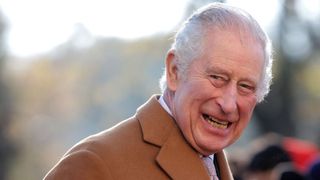 Britain's King Charles III reacts during his visit to the newly built Guru Nanak Gurdwara, in Luton, north of London on December 6, 2022.