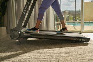 Woman walking on Echelon Stride treadmill