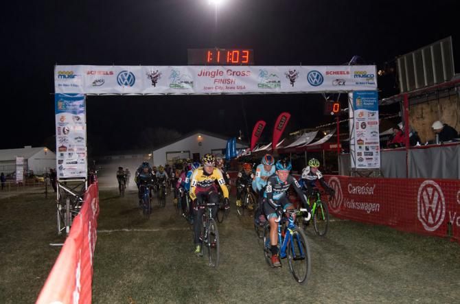 The women's field heads out in cold temperatures under the big lights.