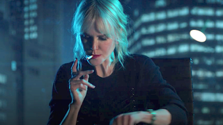 Nine Perfect Strangers Masha smokes a cigarette before being shot.