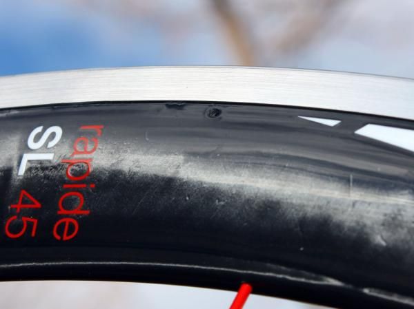 Drain holes should prevent water from collecting inside the rim on wet rides