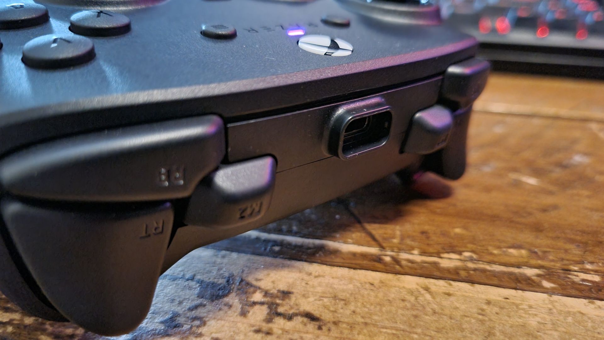 The topside controls of the Razer Wolverine V4 Pro, either side of the protruding USB Type-C port
