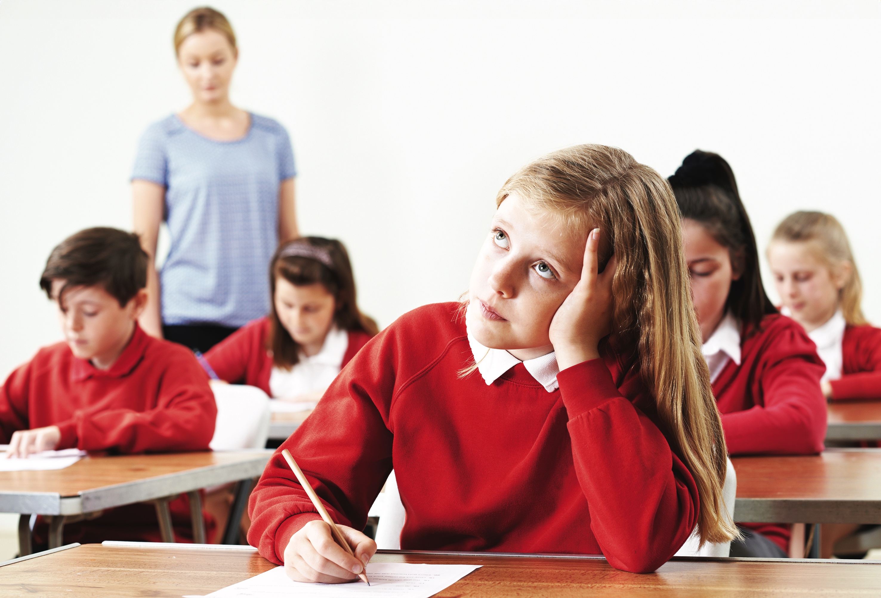 Girl pensively looking up during a test