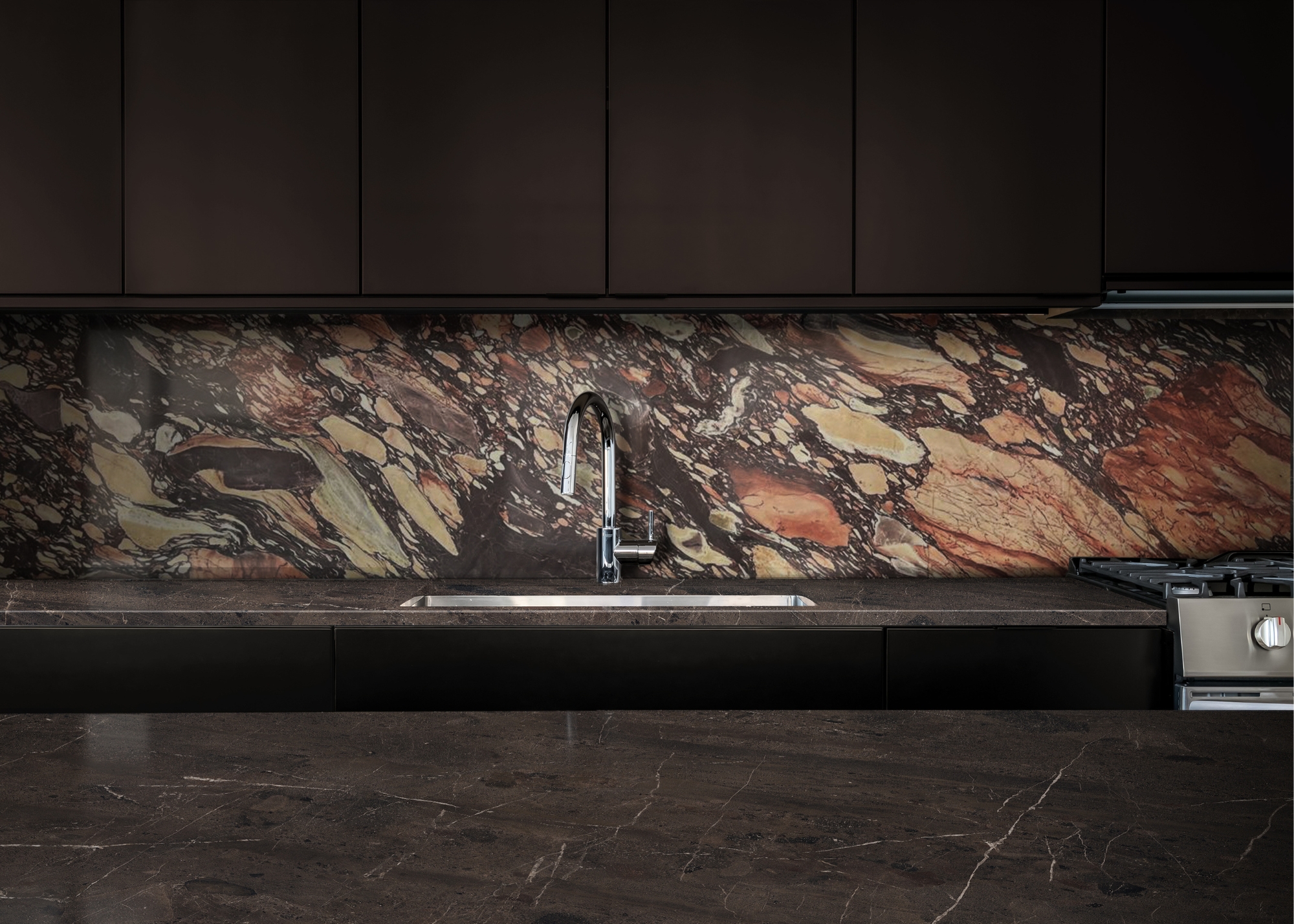 A dark brown kitchen with impressive stone backsplash and dark marble countertops paired with off black cabinetry and a chrome tap